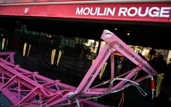 Workers remove the wings of the Moulin Rouge cabaret in Paris on April 25, 2024, after it collapsed last evening. The wings of the windmill on top of the famous Moulin Rouge cabaret fell off during the night on Wednesday the Paris fire department said. No injuries were reported, they said, adding that there was no longer any risk of further collapse. The reasons for the fall are currently unknown. It caused damage to the front of the cabaret, bringing down with it the first three letters of the illuminated sign. Images on social media showed the blade unit lying on the street below, with some of the blades slightly bent from the apparent fall. Photo by Firas Abdullah/ABACAPRESS.COM