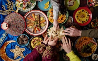 Eid al-Fitr holiday table. Ramadan family dinner. Breaking Fast, iftar. Arabic Middle Eastern traditional cuisine