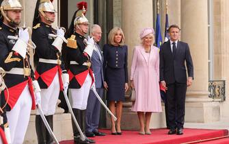 epa10871702 Britain's King Charles III (L), Queen Camilla (2-R), French President Emmanuel Macron (R) and First Lady Brigitte Macron (2-L) pose together at the Elysee Palace in Paris, France, 20 September 2023. The visit, initially planned for March and postponed because of unrests in France, leads the king and queen of Great Britain to Paris and Bordeaux and includes a state dinner, official appointments with President Macron and more informal meetings with French and British citizens.  EPA/TERESA SUAREZ