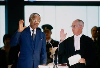 Nelson Mandela is sworn in as the first democratically elected President. Former President of South Africa and longtime political prisoner, Nelson Mandela, was held by the apartheid based government from 1964-1990 for sabotage. With the coming of a freer political climate, Nelson Mandela was released from his life sentence at Victor Vester Prison on February 11, of 1990. He went on to lead the African National Congress in negotiations with President F. W. de Klerk, that resulted in the end of apartheid and full citizenship for all South Africans. He and de Klerk received a joint Nobel Prize in 1993 for their efforts. Mandela was elected president in 1994. (Photo by Â© Louise Gubb/CORBIS SABA/Corbis via Getty Images)