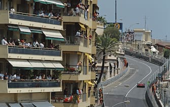 Michael Schumacher of Germany drives the #1 Scuderia Ferrari Marlboro Ferrari F-2001 Ferrari V10 up Beau Rivage past the watching spectators on their balconies during the Formula One Monaco Grand Prix on 27 May 2001 at the Circuit de Monaco, Monte-Carlo, Monaco.  (Photo by Darren Heath/Getty Images)  