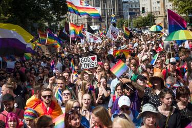 WARSAW, MAZOWIECKIE, POLAND - 2022/06/25: People hold rainbow flags and placards during the Warsaw Pride. The Kyiv Pride organisation joined the march of the Equality Parade in Warsaw to mark their 10th anniversary and Ukrainian LGBTQ+ people's rights. Warsaw and Kyiv Pride are marching together in Polish capital this year, because of the Russian invasion in Ukraine. The Warsaw Pride, also known as the Equality Parade, brought thousands of people to the streets of Warsaw, to spread the ideas of freedom, equality and tolerance. (Photo by Attila Husejnow/SOPA Images/LightRocket via Getty Images)