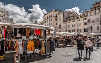Rome, Italy - April 7, 2019: Campo dei Fiori and the Statue of Giordano Bruno in Rome, the Italian Capital. The square is a famous flower and local farmers market.