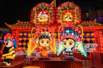 HONG KONG, CHINA - SEPTEMBER 23: People visit the Victoria Park decorated with illuminated lanterns featuring traditional Chinese Opera ahead of the Mid-Autumn Festival on September 23, 2023 in Hong Kong, China. (Photo by Liang Xiashun/VCG via Getty Images)