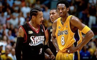 LOS ANGELES - 2001:  Allen Iverson #3 of the Philadelphia 76ers chats with Kobe Bryant #8 of the Los Angeles Lakers during a 2001 NBA game at the Staples Center in Los Angeles. NOTE TO USER: User expressly acknowledges that, by downloading and or using this photograph, User is consenting to the terms and conditions of the Getty Images License agreement. Mandatory Copyright Notice: Copyright 2001 NBAE (Photo by Andrew D. Bernstein/NBAE via Getty Images)
