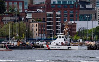 Two US Coast Guard vessels sit in port in Boston Harbor across from the US Coast Guard Station Boston in Boston, Massachusetts, on June 19, 2023. A submersible vessel used to take tourists to see the wreckage of the Titanic in the North Atlantic has gone missing, triggering a search-and-rescue operation, the US Coast Guard said on June 19, 2023. It was not immediately known how many people are on the vessel, operated by a company called OceanGate Expeditions. "Yes, we're searching for it," said an official from the US Coast Guard Rescue Coordination Center in Boston. (Photo by Joseph Prezioso / AFP) (Photo by JOSEPH PREZIOSO/AFP via Getty Images)