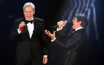 Italian singer and Sanremo Festival artistic director Claudio Baglioni (L) and Italian singer Gianni Morandi (R) performs on stage during the 68th Sanremo Italian Song Festival at the Ariston theatre in Sanremo, Italy, 06 February 2018. The 68th edition of the television song contest runs from 06 to 10 February. ANSA/CLAUDIO ONORATI 