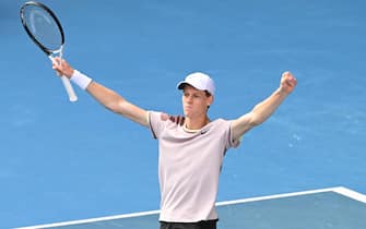 epa11105007 Jannik Sinner of Italy celebrates match point during his Men's semifinal win over Novak Djokovic of Serbia on Day 13 of the 2024 Australian Open at Melbourne Park in Melbourne, Australia 26 January 2024.  EPA/JAMES ROSS AUSTRALIA AND NEW ZEALAND OUT