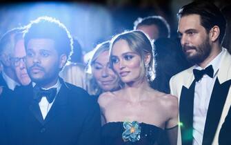 (From L) Canadian singer Abel Makkonen Tesfaye aka The Weeknd, French-US actress Lily-Rose Depp and US director Sam Levinson arrive for the screening of the film "The Idol" during the 76th edition of the Cannes Film Festival in Cannes, southern France, on May 22, 2023. (Photo by CHRISTOPHE SIMON / AFP) (Photo by CHRISTOPHE SIMON/AFP via Getty Images)