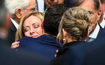 Italian Prime Minister Giorgia Meloni embraces Italian former Prime Minister, Silvio Berlusconi son Pier Silvio Berlusconi at the end of Italy's former Prime Minister and media mogul Silvio Berlusconi funeral outside the Duomo cathedral in Milan on June 14, 2023. (Photo by Piero CRUCIATTI / AFP) (Photo by PIERO CRUCIATTI/AFP via Getty Images)