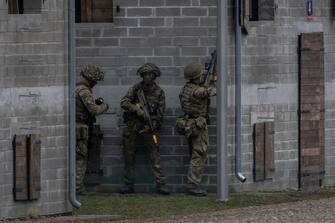 Soldiers of the NATO Response Force (NRF) are seen during a practice witnessed by the Polish Defence Minister and Britain's Defence Secretary on a military training compound next to Orzysz, North-Eastern Poland, on March 13, 2024. Britain's Secretary of Defense visits the NATO-organized Steadfast Defender 2024 military exercise in Poland. (Photo by Wojtek Radwanski / AFP) (Photo by WOJTEK RADWANSKI/AFP via Getty Images)