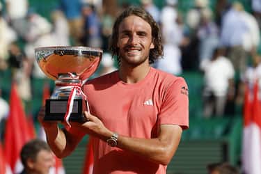 epa11278423 Stefanos Tsitsipas of Greece poses with his trophy after winning his final match against Casper Ruud of Norway in their final match at the ATP Monte Carlo Masters tournament in Roquebrune Cap Martin, France, 14 April 2024.  EPA/Sebastien Nogier