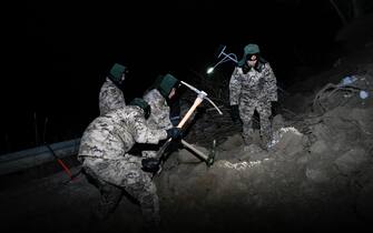 JISHISHAN, CHINA - DECEMBER 19: Rescuers clear the debris of houses after a 6.2-magnitude earthquake on December 19, 2023 in Jishishan Bonan, Dongxiang and Salar Autonomous County, Linxia Hui Autonomous Prefecture, Gansu Province of China. A 6.2-magnitude earthquake jolted Jishishan county in Gansu province on Monday, leaving at least 111 people dead. (Photo by Hou Chonghui/VCG via Getty Images)