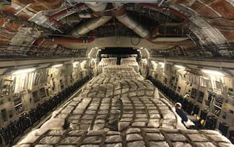 UNSPECIFIED, UNSPECIFIED - MARCH 2020: In this handout image provided the U.S Air Force dated March 16-17, the U.S. Air Forceâ  s Air Mobility Command transported a shipment of 13 pallets containing 500,000 COVID-19 testing swabs aboard a C-17 Globemaster III from Aviano Air Base, Italy, to Memphis Air National Guard Base, Tennessee. (Photo by U.S Air Force via Getty Images)