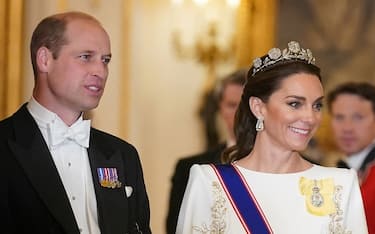 Britain's Prince William, Prince of Wales (L) and Britain's Catherine, Princess of Wales arrive for a a State Banquet at Buckingham Palace in central London on November 21, 2023, for South Korea's President Yoon Suk Yeol and his wife Kim Keon Hee on their first day of a three-day state visit to the UK. South Korean President Yoon Suk Yeol and First Lady Kim Keon Hee began a three-day trip to the UK on Tuesday, with King Charles III's hosting his first state visitors since his coronation. (Photo by Yui Mok / POOL / AFP) (Photo by YUI MOK/POOL/AFP via Getty Images)