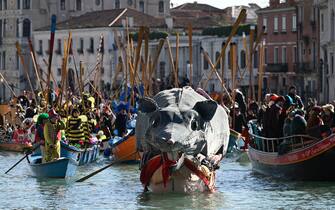 Decorated boats sail on the Grand Canal during Venice Carnival, on February 16, 2025. This year, the theme of one of the most famous carnival in the world is Casanova, as the 'Serenissima' celebrates the 300th anniversary of the famous man's birth. (Photo by ANDREA PATTARO / AFP)