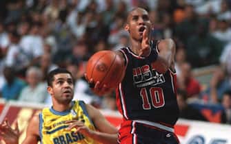 7 AUG 1994:  USA'S REGGIE MILLER #10 MAKES A LAYUP AFTER BEATING BRAZIL'S CARLOS 'OLIVIA'DO NASCIMENTO #15 DOWN THE COURT ON A FAST BREAK DURING THEIR WORLD CHAMPIONSHIP OF BASKETBALL MATCHUP AT THE COPPS COLISEUM IN HAMILTON, ONTARIO, CANADA.USA DEFEATED