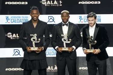 MILAN, ITALY - DECEMBER 04: (L-R) Rafael Leao, Victor Osimhen and Khvicha K'varatskhelia receive the AIC Oscar del Calcio Awards on December 04, 2023 in Milan, Italy. (Photo by Pier Marco Tacca/Getty Images )