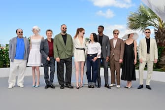 CANNES, FRANCE - MAY 18: Yorgos Stefanakos, Hunter Schafer, Willem Dafoe, Yorgos Lanthimos, Emma Stone, Hong Chau, Mamoudou Athie, Jesse Plemons, Margaret Qualley and Joe Alwyn attends the "Kinds Of Kindness" Photocall at the 77th annual Cannes Film Festival at Palais des Festivals on May 18, 2024 in Cannes, France. (Photo by Stephane Cardinale - Corbis/Corbis via Getty Images)
