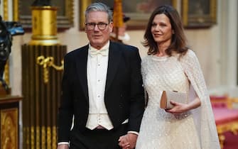 Labour leader Sir Keir Starmer with his wife Victoria make their way along the East Gallery to attend the State Banquet for Emperor Naruhito and his wife Empress Masako of Japan at Buckingham Palace, London, as part of their state visit to the UK. Picture date: Tuesday June 25, 2024.