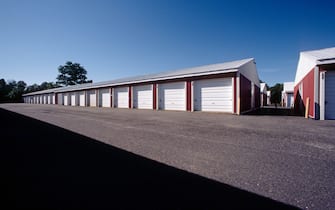 Daytime view of garage like rental storage units lined up in a row