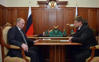 Russian President Vladimir Putin (L) speaks with Head of the Chechen Republic Ramzan Kadyrov during a working meeting in the Kremlin in Moscow, Russia, 04 December 2014. ANSA/ALEXEI DRUZHININ / RIA NOVOSTI / KREMLIN POOL