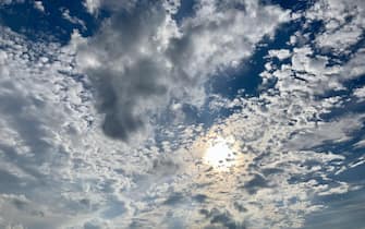 Dramatic sky with sun and clouds