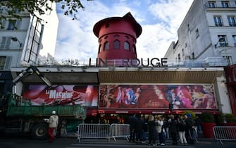 Workers remove the wings of the Moulin Rouge cabaret in Paris on April 25, 2024, after it collapsed last evening. The wings of the windmill on top of the famous Moulin Rouge cabaret fell off during the night on Wednesday the Paris fire department said. No injuries were reported, they said, adding that there was no longer any risk of further collapse. The reasons for the fall are currently unknown. It caused damage to the front of the cabaret, bringing down with it the first three letters of the illuminated sign. Images on social media showed the blade unit lying on the street below, with some of the blades slightly bent from the apparent fall. Photo by Firas Abdullah/ABACAPRESS.COM