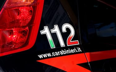 Side of an Italian Carabinieri car with emergency number 112 and website. Puglia, Italy. High quality photo