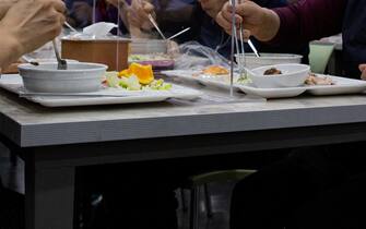 epa08432970 People eat lunch at tables equipped with plastic barriers to prevent possible spread of coronavirus at the cafeteria of Seoul city hall in Seoul, South Korea, 20 May 2020. Countries around the world are taking increased measures to stem the widespread of the SARS-CoV-2 coronavirus which causes the Covid-19 disease.  EPA/JEON HEON-KYUN