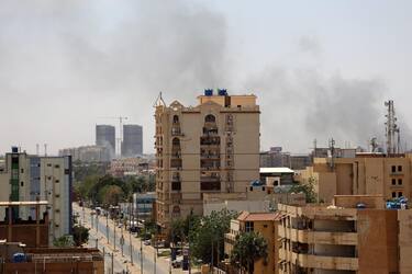 epa10578767 A civilian holds up an empty bullet case in front of a damaged window of a residential building during ongoing skirmish between Sudanese army and paramilitaries of the Rapid Support Forces (RSF) in Khartoum, Sudan, 18 April 2023. A power struggle erupted 15 April between the Sudanese army led by army Chief General Abdel Fattah al-Burhan and the paramilitaries of the Rapid Support Forces (RSF) led by General Mohamed Hamdan Dagalo, resulting in at least 200 deaths according to doctors' association in Sudan. The RSF on 18 April said it approved a 24-hour ceasefire to allow evacuation of the wounded, however the Sudanese army did not confirm the deal.  EPA/STRINGER