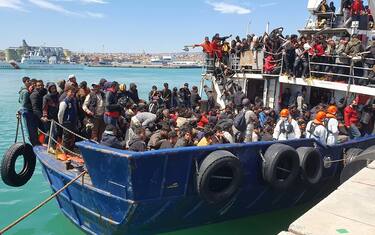 The fishing boat carrying about 600 migrants rescued in recent days 100 miles off the coast of Sicily towed by a tugboat arrived in the port of Catania, Italy, 12 April 2023. The vessel was escorted by the 'Nave Peluso' of the Coast Guard. The migrants on board greeted their arrival with applause and whistles and shouts of 'Bella Italia'.
ANSA/Orietta Scardino