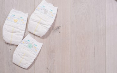 baby diapers on wooden background