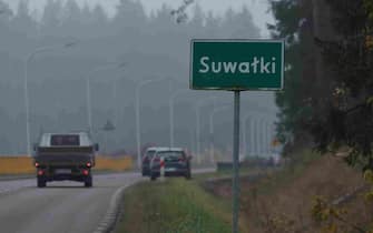 SUWALKI, POLAND - OCTOBER 28: Traffic passes a town limits sign for Suwalki on October 28, 2022 in Suwalki, Poland. Suwalki is the namesake for the strategically vital Suwalki Gap, an approximately 70km long stretch of land along the Lithuanian and Polish border between Kaliningrad and Russia-loyal Belarus. Should a military conflict ever break out, Russian control of the Suwalki Gap would cut the three Baltic states of Lithuania, Latvia and Estonia off from the rest of the European Union.  (Photo by Sean Gallup/Getty Images)