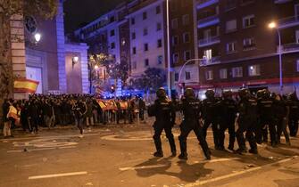 MADRID, SPAIN - 2023/11/09: Riot police confront protesters during a protest in front of socialist party PSOE headquarters in Ferraz street for the seventh consecutive day of protests following the recent agreement between PSOE and Junts party, which unfolded today in Brussels. Thousands responded to a call by far right groups to protest the approval of an amnesty for Catalan separatist leaders which is included in the agreement and guarantees the investiture of the socialist candidate Pedro Sanchez. (Photo by Marcos del Mazo/LightRocket via Getty Images)