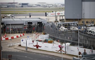 epa11977964 Service vehicles are parked at Heathrow Airport in Hillingdon, London, Britain, 21 March 2025. Heathrow Airport on 21 March announced it would be closed all day, following a power outage 'due to a fire at an electrical substation supplying the airport'.  EPA/TOLGA AKMEN