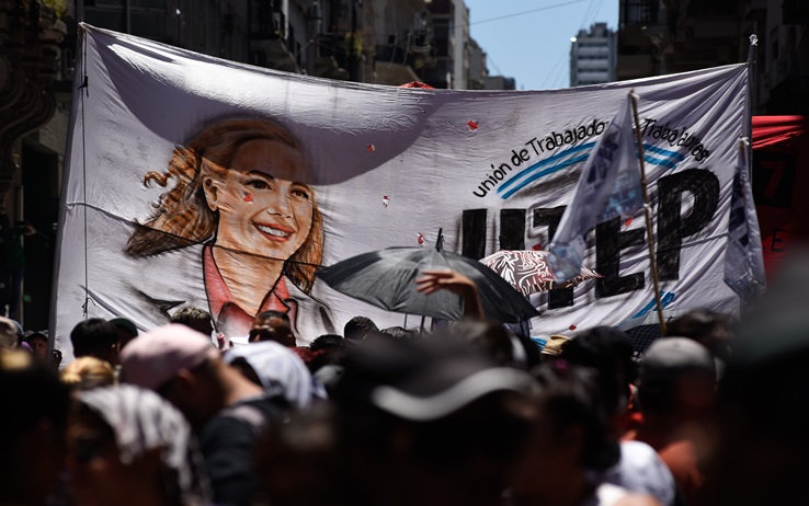 24 January 2024, Argentina, Buenos Aires: Members of the trade union UTEP carry a banner with the image of Eva Peron, "Evita", during a protest against the reform plans of President Milei's ultra-liberal government on the day of a general strike. Trade unions had called for the general strike. With inflation at 211.4 percent, the new government wants to push through a radical austerity and reform program. Photo: Martin Cossarini/dpa - ATTENTION: For editorial use only and only with full reference to the above credit (Photo by Martin Cossarini/picture alliance via Getty Images)