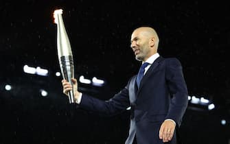 Paris 2024 Olympics - Opening Ceremony - Paris, France - July 26, 2024. Torchbearer Zinedine Zidane is seen during the opening ceremony. (Photo by Stephanie Lecocq / POOL / AFP) (Photo by STEPHANIE LECOCQ/POOL/AFP via Getty Images)