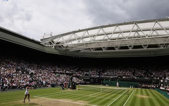 epa11475861 Jasmine Paolini (L) of Italy in action during her Women's Singles final match against Barbora Krejcikova of the Czech Republic at the Wimbledon Championships in London, Britain, 13 July 2024.  EPA/NEIL HALL  EDITORIAL USE ONLY