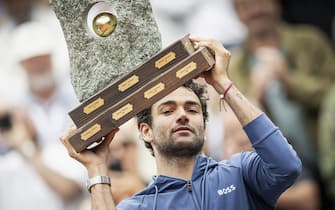 Italy's Matteo Berrettini holds up the trophy after winning the final match against France's Quentin Halys at the Swiss Open tennis tournament in Gstaad, on July 21, 2024. (Photo by GABRIEL MONNET / AFP) (Photo by GABRIEL MONNET/AFP via Getty Images)