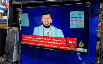 epa11087828 A person watches top Houthi leader, Abdul-Malik al-Houthi, delivering a TV speech, a day after the USA re-designated his movement as a global terrorist group, in Sana'a, Yemen, 18 January 2024. Top Houthi leader Abdul-Malik al-Houthi vowed to keep up attacks carried out by his movement's forces on ships in the Red Sea and the Gulf of Aden despite recent strikes from US and British forces. The United States has announced the designation of Yemen's Houthis as a global terror group amid an escalation of their attacks on shipping lanes in the Red Sea, the Bab al-Mandab Strait, and the Gulf of Aden since November 2023. The US Department of Defense announced in December 2023 a multinational operation to safeguard trade and protect ships in the Red Sea amid the recent escalation in Houthi attacks. Houthis vowed to keep up attacks on Israeli-bound ships and prevent them from navigating in the Red Sea and the Bab al-Mandab Strait in retaliation for Israel's airstrikes on the Gaza Strip, according to statements by Houthis' military spokesman, Yahya Sarea.  EPA/YAHYA ARHAB