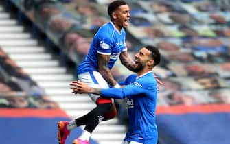 Rangers' James Tavernier (left) celebrates with Connor Goldson after Aberdeen goalkeeper Joe Lewis scores an own goal during the Scottish Premiership match at Ibrox Stadium, Glasgow. Picture date: Saturday May 15, 2021.