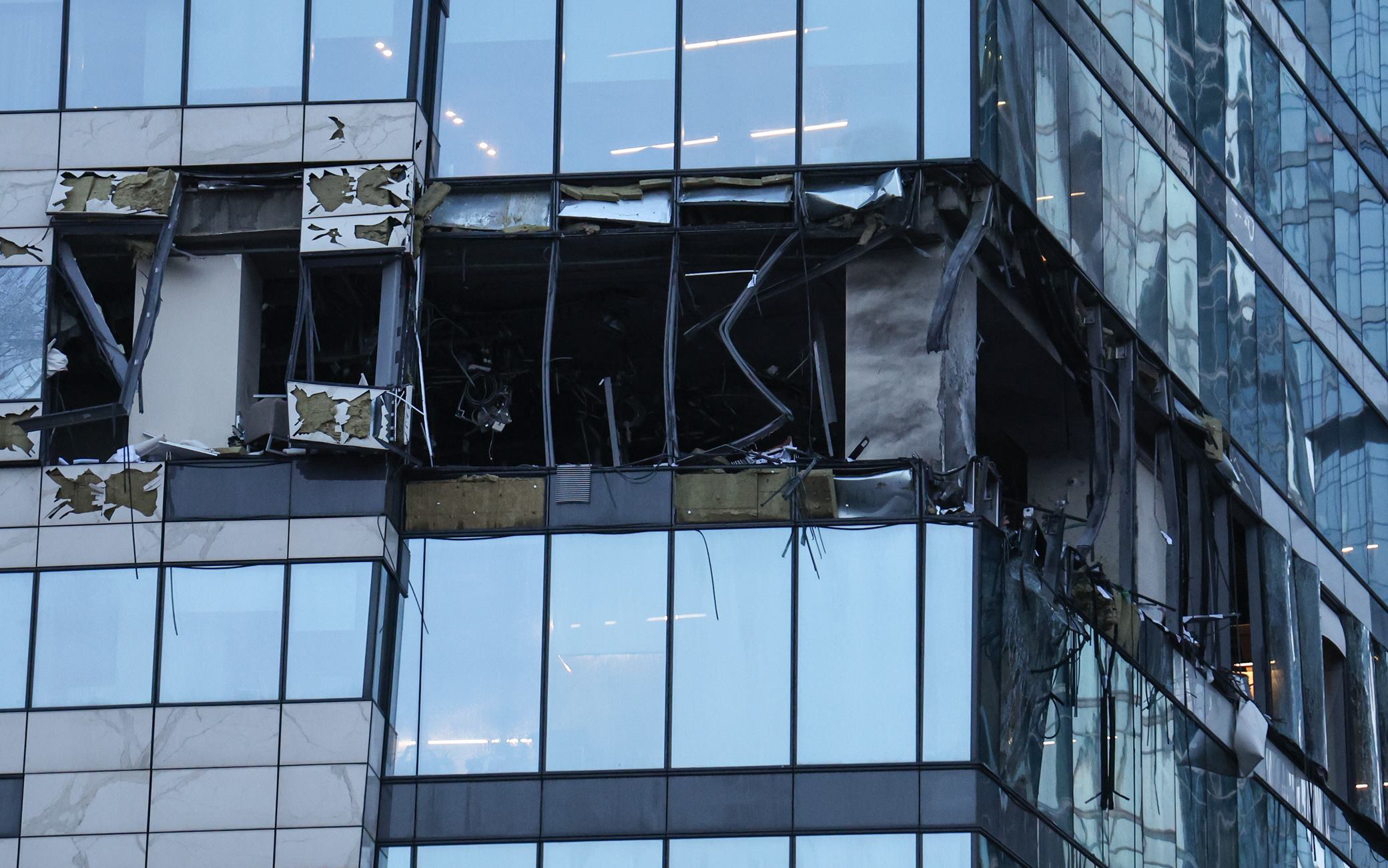 RUSSIA, MOSCOW - JULY 30, 2023: The aftermath of an explosion in a tower of the IQ-Quarter complex at the Moscow International Business Centre (Moscow City). Earlier, Moscow Mayor Sergei Sobyanin said the city was attacked by Ukrainian drones; according to the Russian Defence Ministry, three Ukrainian UAVs took part in the attack, one of them destroyed in the air over the Moscow Region's Odintsovo District. Moscow's Vnukovo Airport was temporarily closed for traffic amid the accident. Mikhail Tereshchenko/TASS/Sipa USA