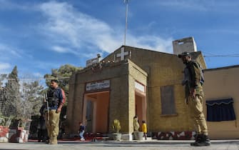 Security personnel stand guard outside the Bethel Memorial Methodist church during Christmas prayer in Quetta on December 25, 2023. (Photo by Banaras KHAN / AFP)