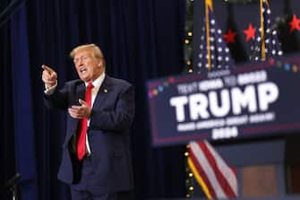 WATERLOO, IOWA - DECEMBER 19: Republican presidential candidate and former U.S. President Donald Trump gestures as he wraps up a campaign event on December 19, 2023 in Waterloo, Iowa. Iowa Republicans will be the first to select their party's nomination for the 2024 presidential race, when they go to caucus on January 15, 2024. (Photo by Scott Olson/Getty Images)