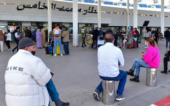 People wait for arrivals outside the Mohammed V airport in the western Moroccan city of Casablanca on February 7, 2022. - Morocco reopened its airspace in a bid to breathe life into its crisis-hit tourism sector, two months after it cancelled commercial flights over coronavirus fears. (Photo by AFP) (Photo by -/AFP via Getty Images)