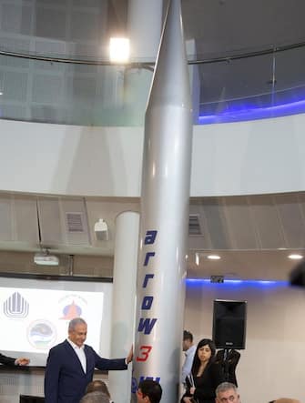 Israeli Prime Minister Benjamin Netanyahu points at the Arrow-3 Anti-ballistic Missile System at the Israeli Aerospace Industries (IAI) MLM Division plant in the central Israeli town of Be'er Ya'akov on January 22, 2019. - Israel said it had conducted a successful test of the Arrow 3 Missile Defense System jointly developed with the United States. (Photo by Tomer Appelbaum / various sources / AFP)        (Photo credit should read TOMER APPELBAUM/AFP via Getty Images)