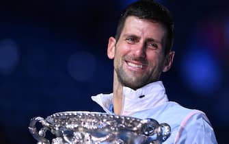epaselect epa10438216 Novak Djokovic of Serbia holds the Norman Brookes Challenge Cup after winning the menâ  s singles final against Stefanos Tsitsipas of Greece at the 2023 Australian Open tennis tournament in Melbourne, Australia, 29 January 2023.  EPA/James Ross AUSTRALIA AND NEW ZEALAND OUT