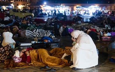 Residents stay out at a square in Marrakesh on September 9, 2023, after an earthquake. A powerful earthquake that struck Morocco on September 8 night has killed at least 632 people and injured 329 others, according to an updated interior ministry toll. (Photo by FADEL SENNA / AFP)