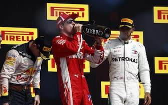 CIRCUIT OF THE AMERICAS, UNITED STATES OF AMERICA - OCTOBER 21: Kimi Raikkonen, Ferrari, 1st position, celebrates with Champagne on the podium during the United States GP at Circuit of the Americas on October 21, 2018 in Circuit of the Americas, United States of America. (Photo by Andy Hone / LAT Images)